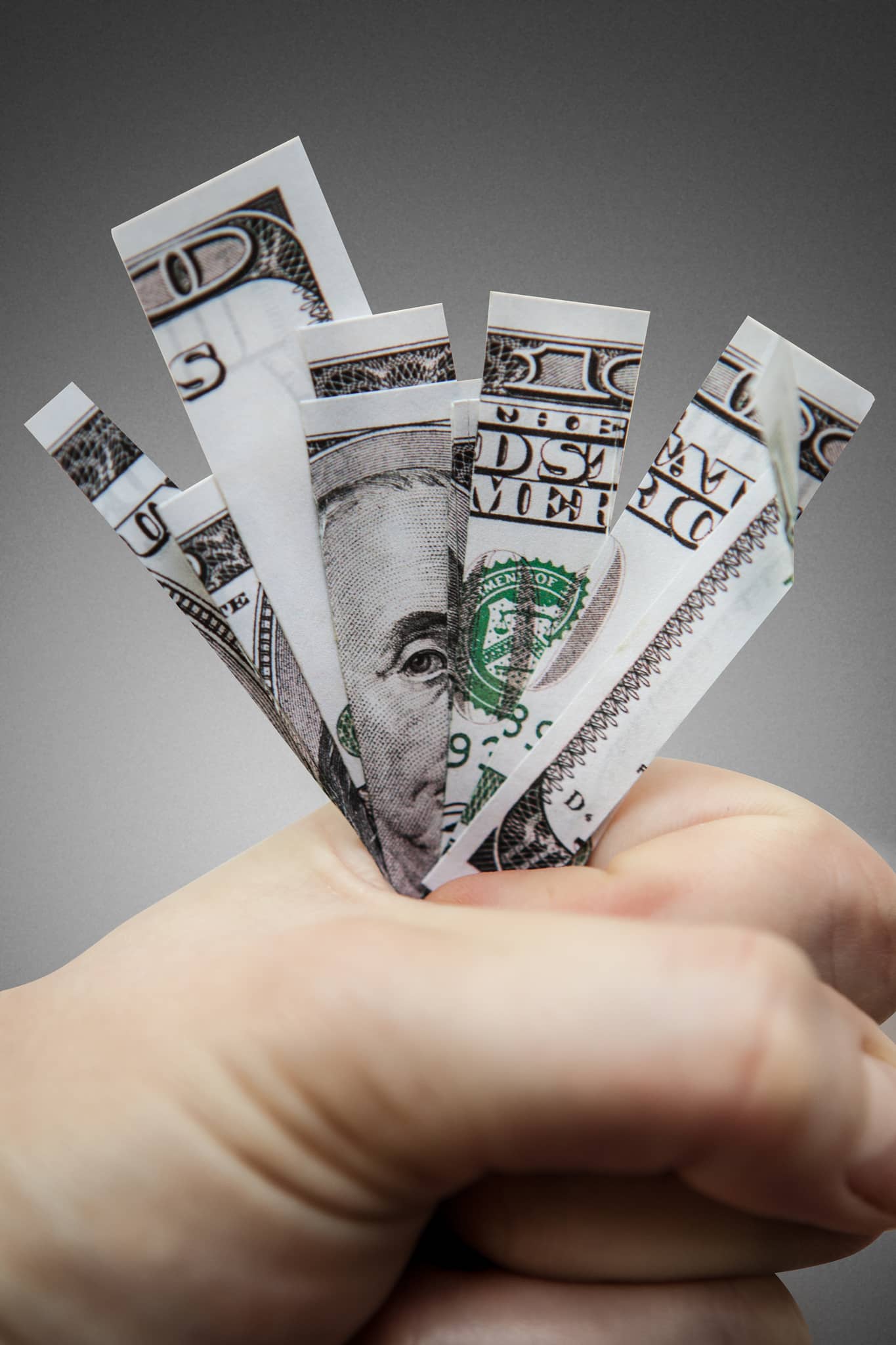 photo of cut up money in hand