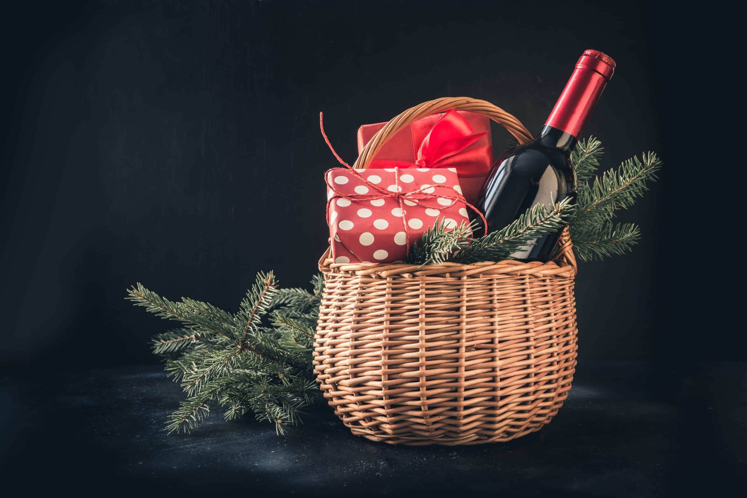 Holiday Basket with wine and wrapped gifts